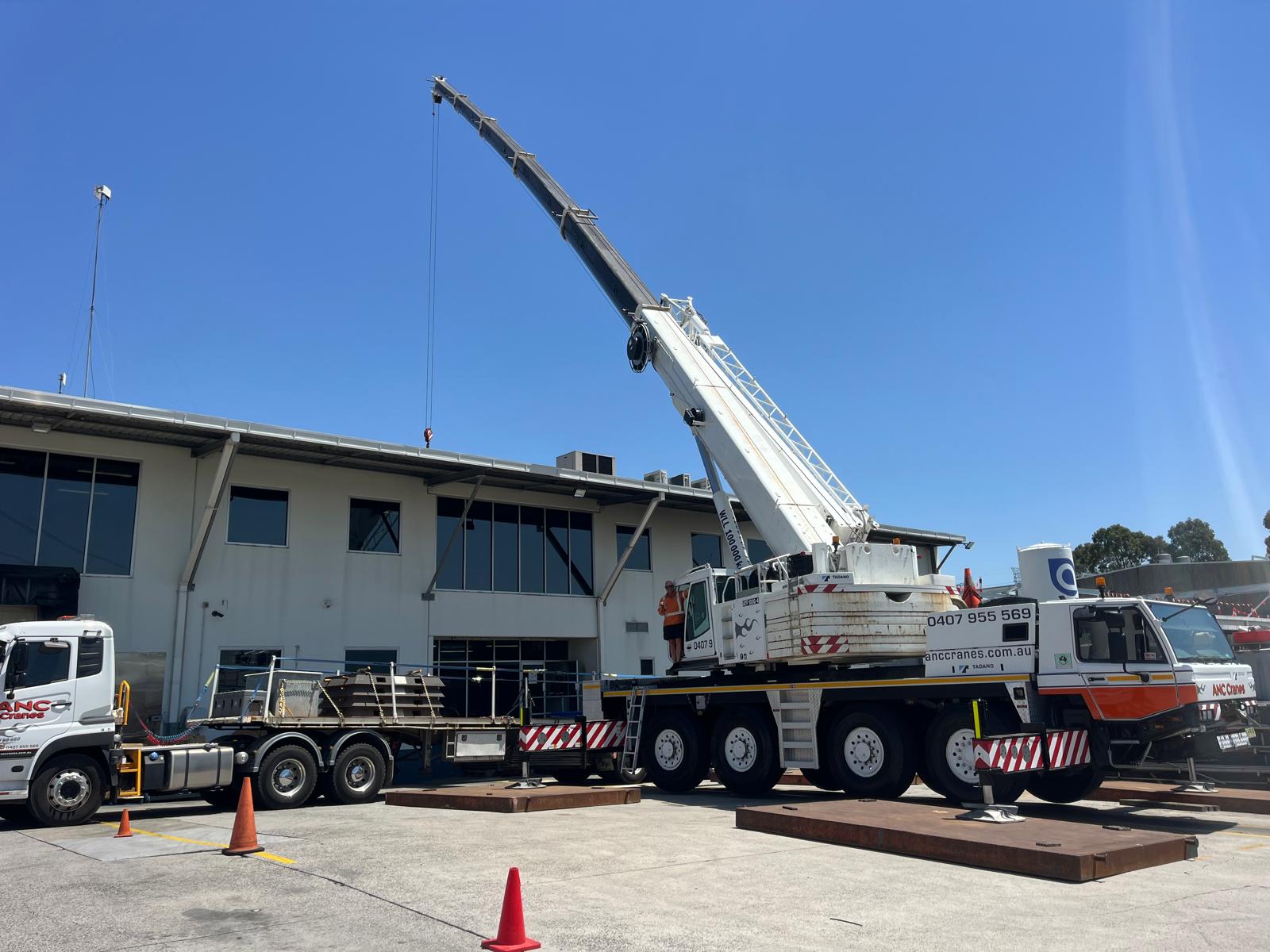 ANC Cranes 100 tonne crane lifting roofing materials