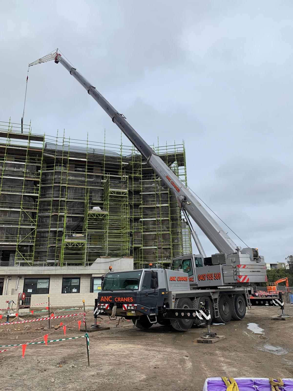ANC Cranes supporting a high rise construction lift